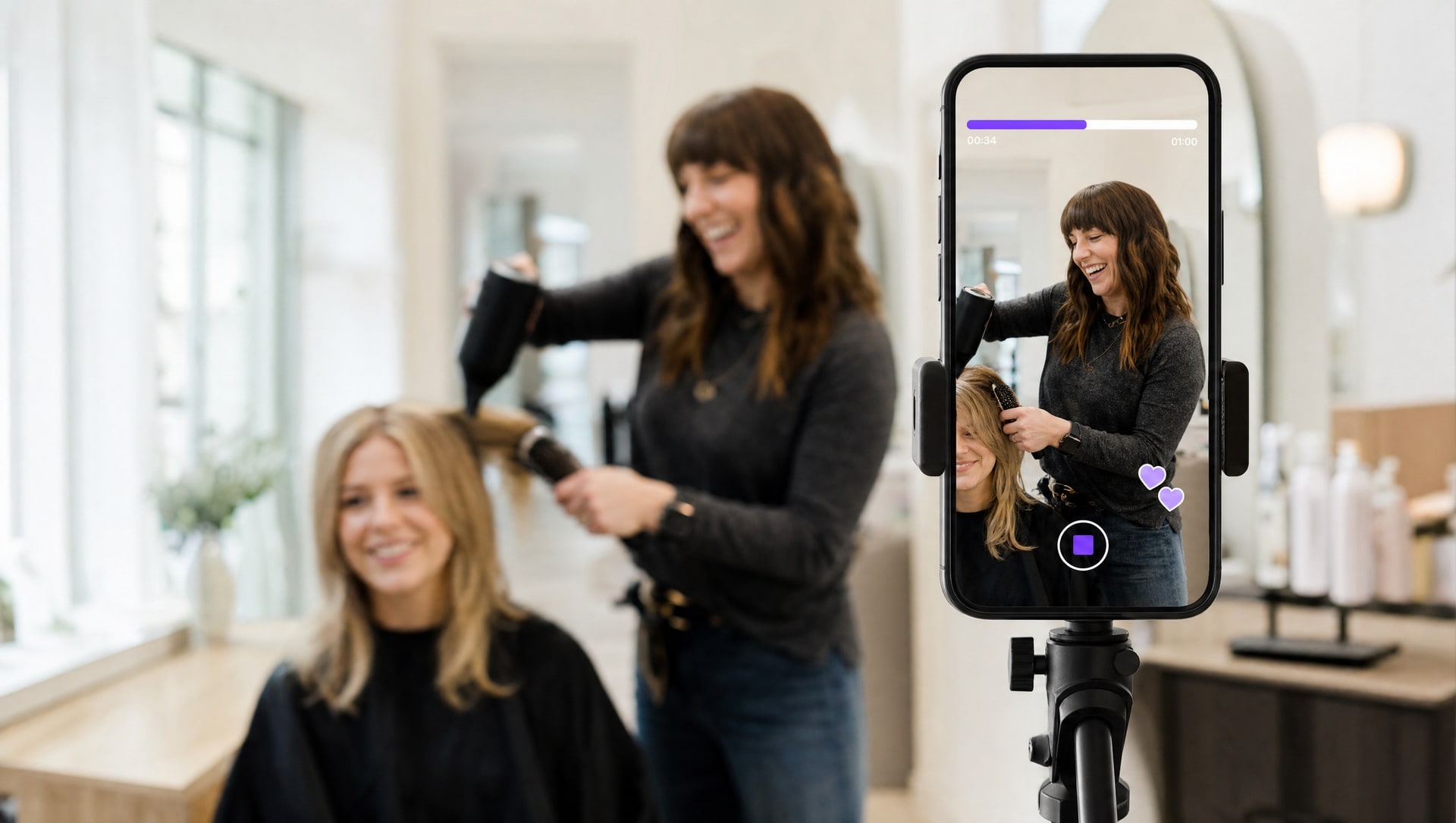 A salon owner filming a short video on a phone mounted on a tripod, recording content inside her salon.